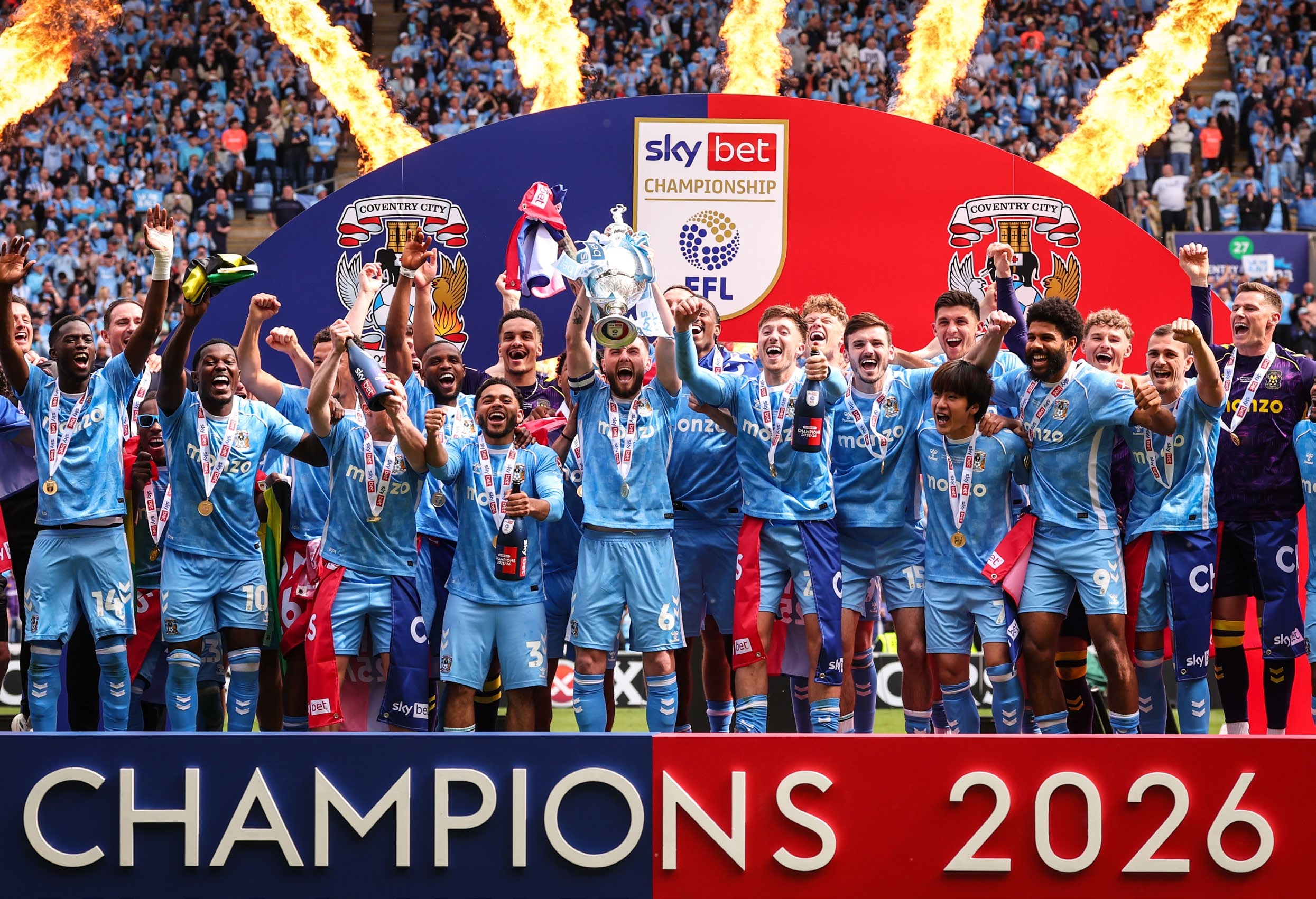 Coventry City players lift the trophy as they celebrate winning the Championship title. (Photo by Marc Atkins/Getty Images)