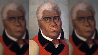Portrait of Kamehameha I. Original title of this painting was "Tamaahamaah, King of Sandwich Islands". Here we see an older man with short gray/white hair and brown eyes. He is wearing a red jacket with white arms and a black collar.