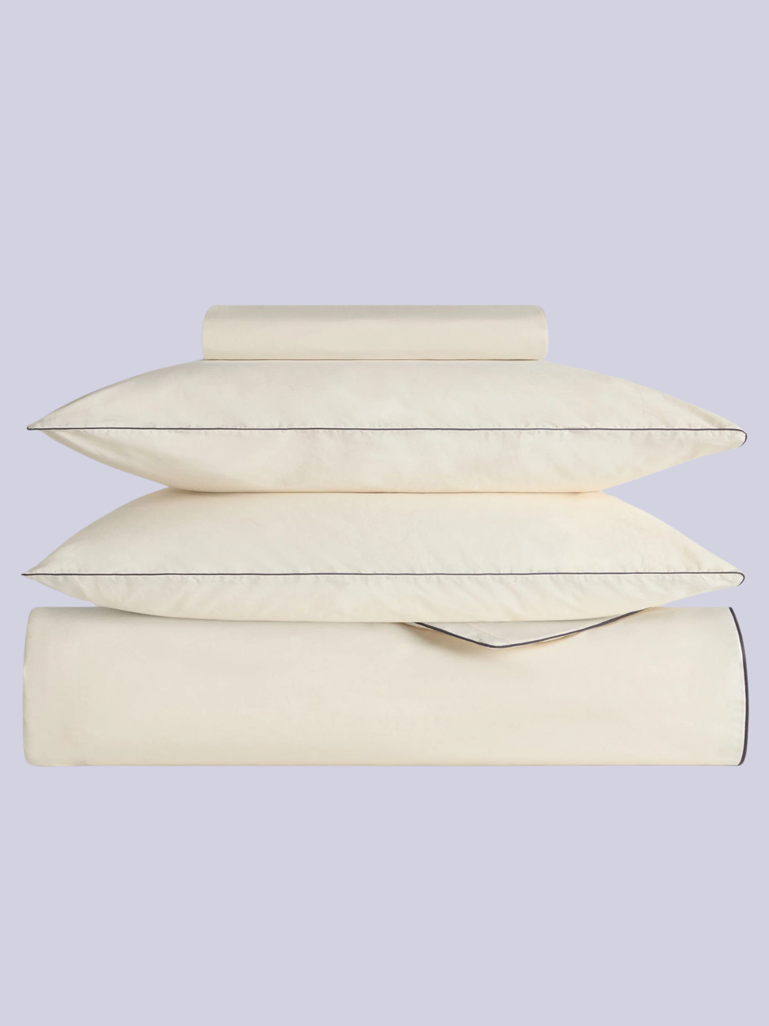 A buttermilk bedding set with navy piping