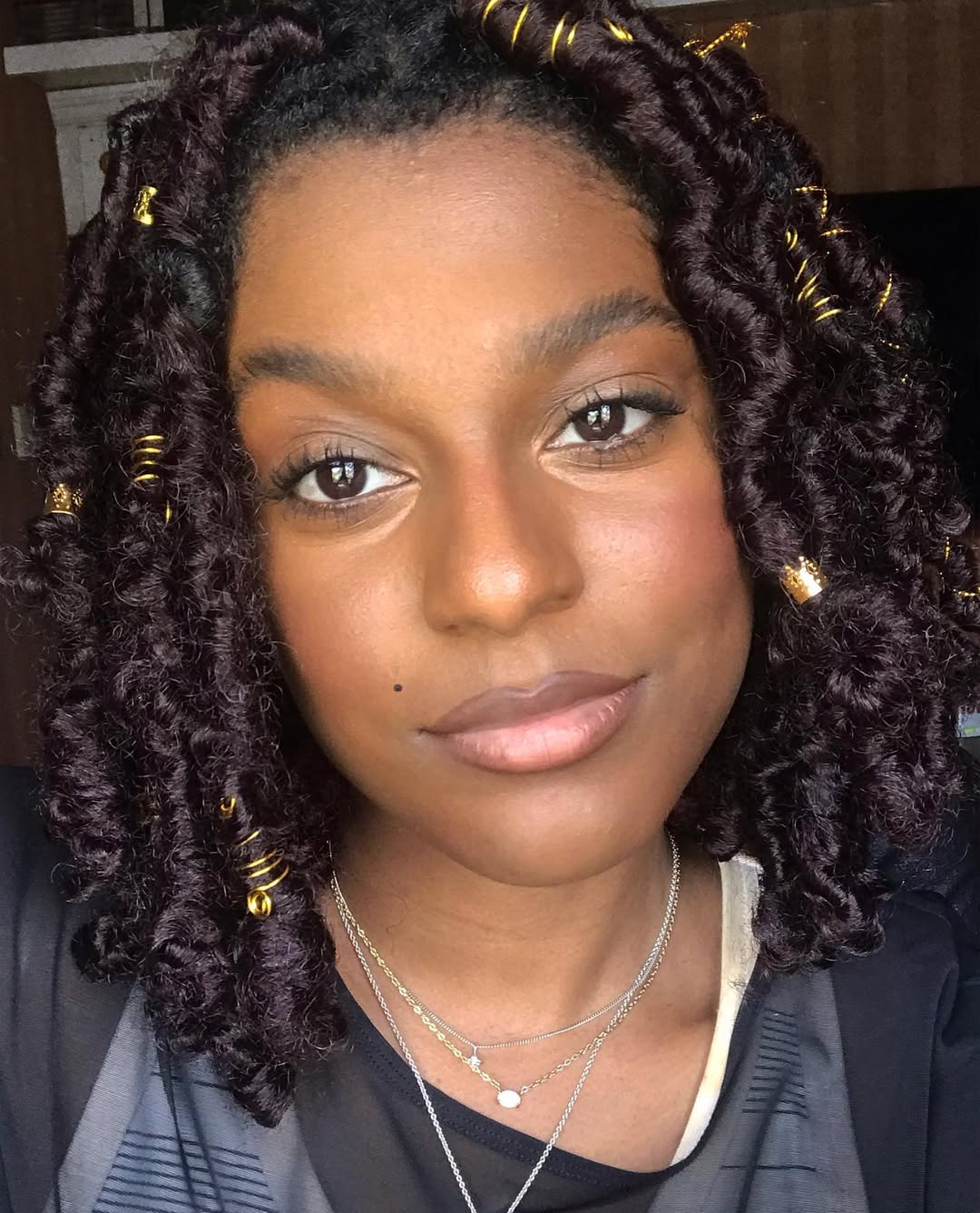 Shei Mamona with faux locs