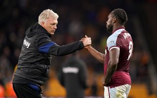 West Ham United manager David Moyes shakes hands with Michail Antonio after the Premier League match at Molineux Stadium, Wolverhampton. Picture date: Saturday November 20, 2021