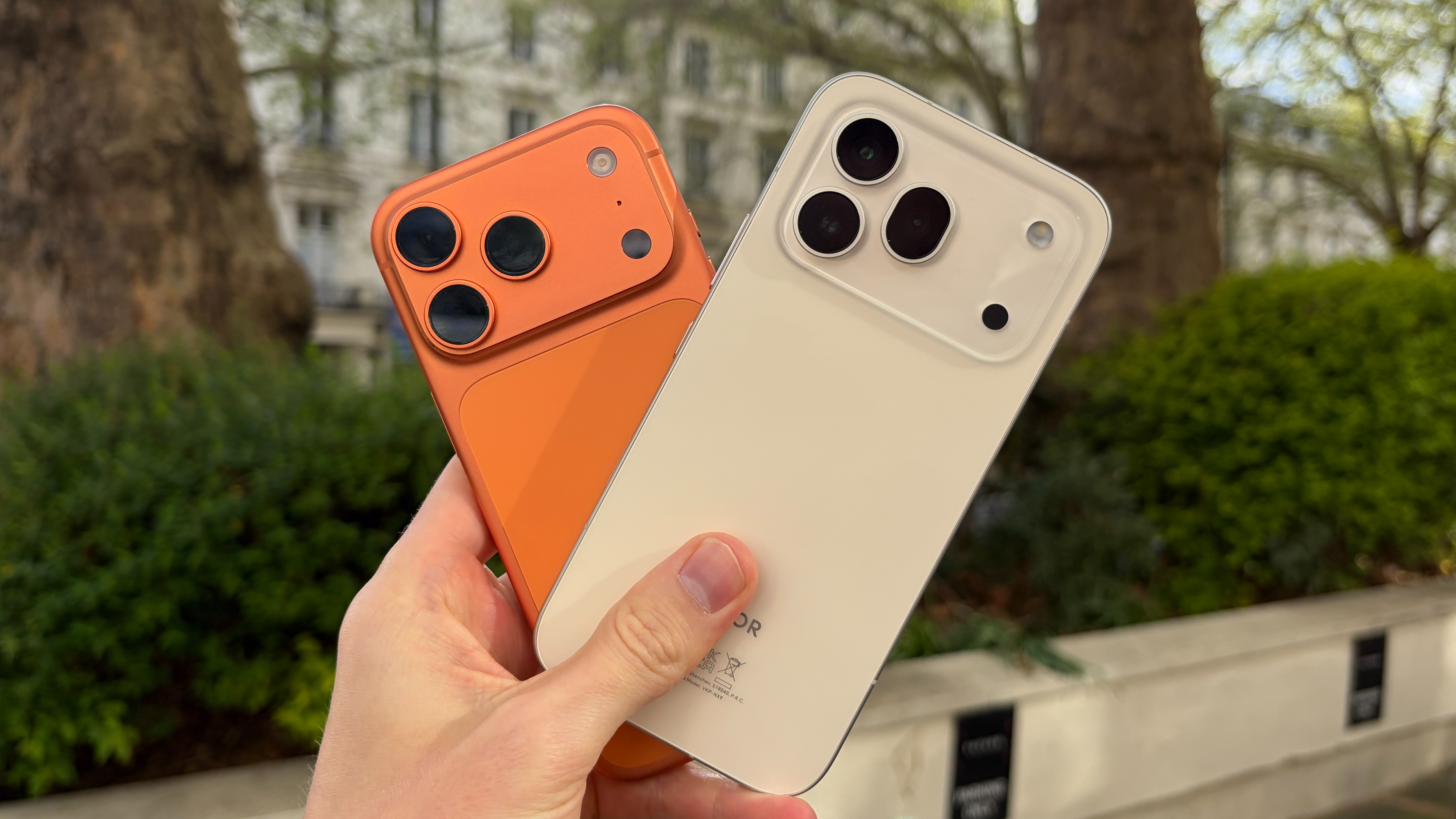 The iPhone 17 Pro alongside the Honor 600 Pro, both being held in the hand