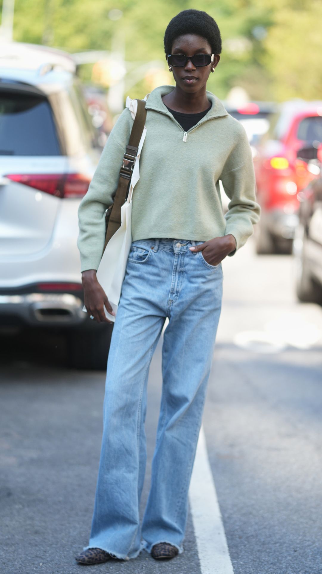 a street style outfit with a quarter zip jumper