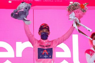 Team Ineos rider Colombias Egan Bernal celebrates his overall leaders pink jersey on the podium after the 15th stage of the Giro dItalia 2021 cycling race 147km between Grado and Gorizia on May 23 2021 Photo by Luca Bettini AFP Photo by LUCA BETTINIAFP via Getty Images