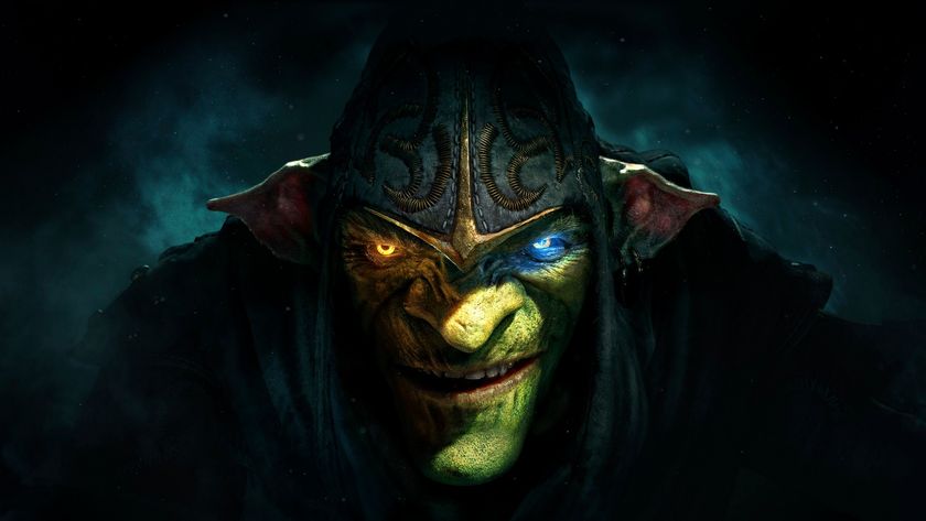 A close-up of Styx looking up from under his hood in darkness, one eye glowing amber, and the other light blue