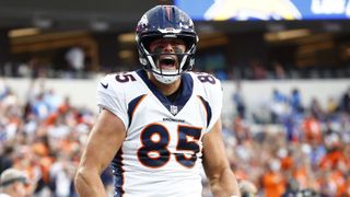  Lucas Krull #85 of the Denver Broncos, wearing a while NFL helmet, roars with delight ahead of the Broncos vs Lions game.