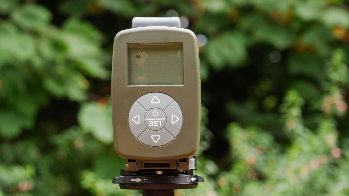 Camtraptions Camera Trap device outdoors with foliage backdrop