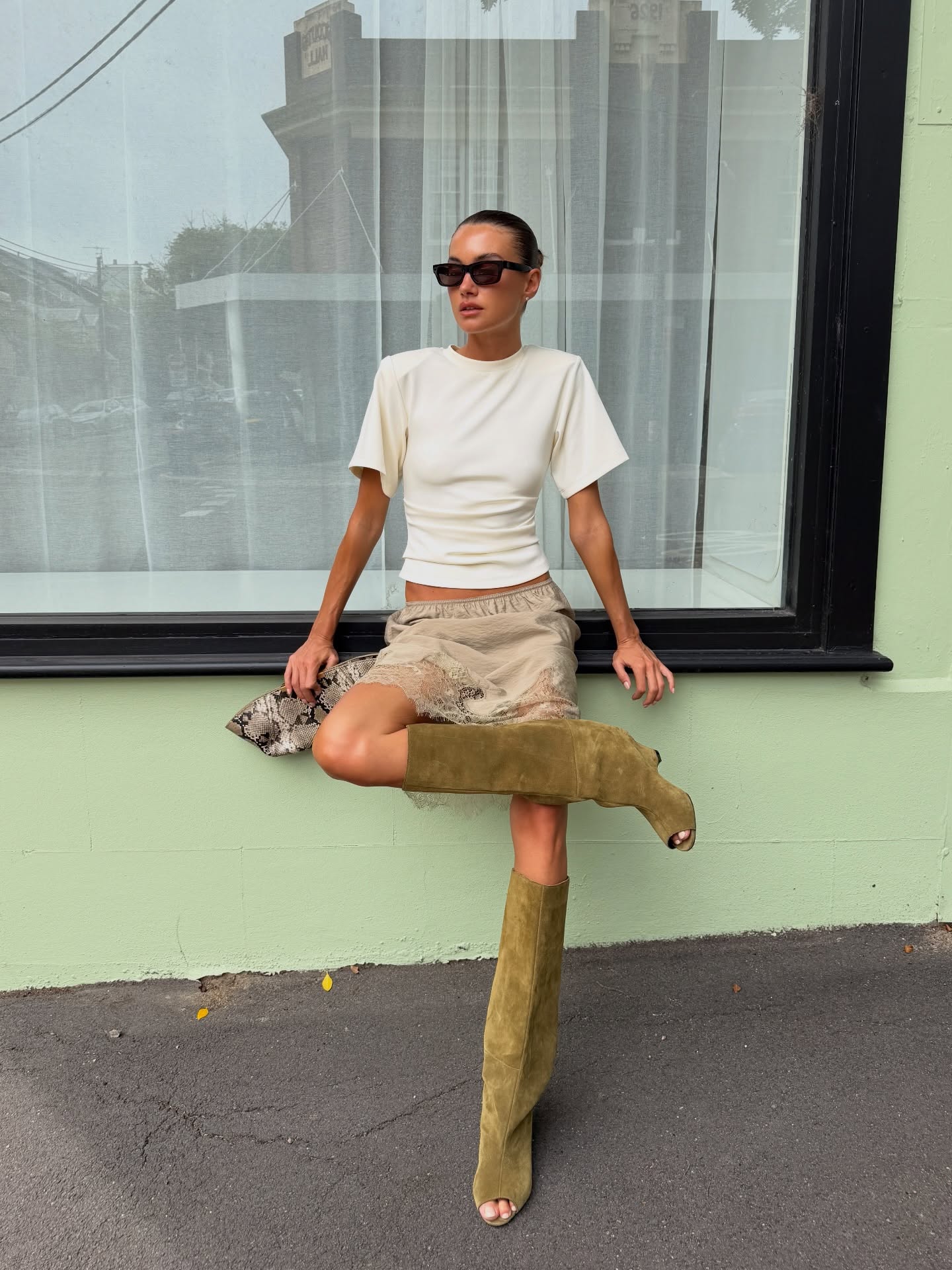 An image of @edenkannourakis wearing a henne silk skirt.
