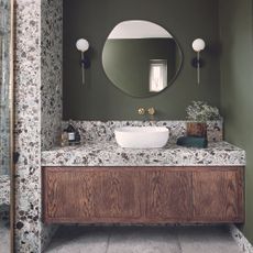 The Tap End green and stone bathroom