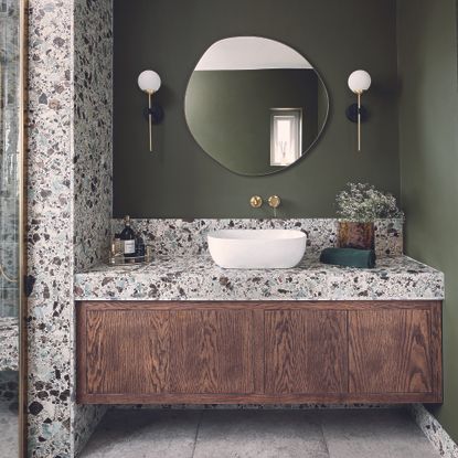 The Tap End green and stone bathroom