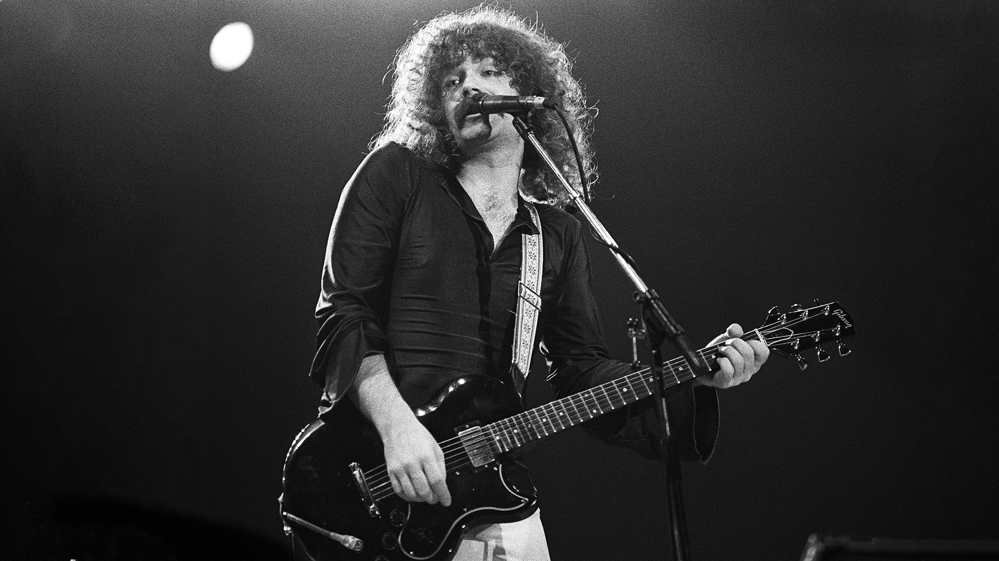 Brad Delp of Boston performs on stage at Ahoy on 9th October 1979 in Rotterdam, Netherlands. He plays a Gibson L6-S guitar
