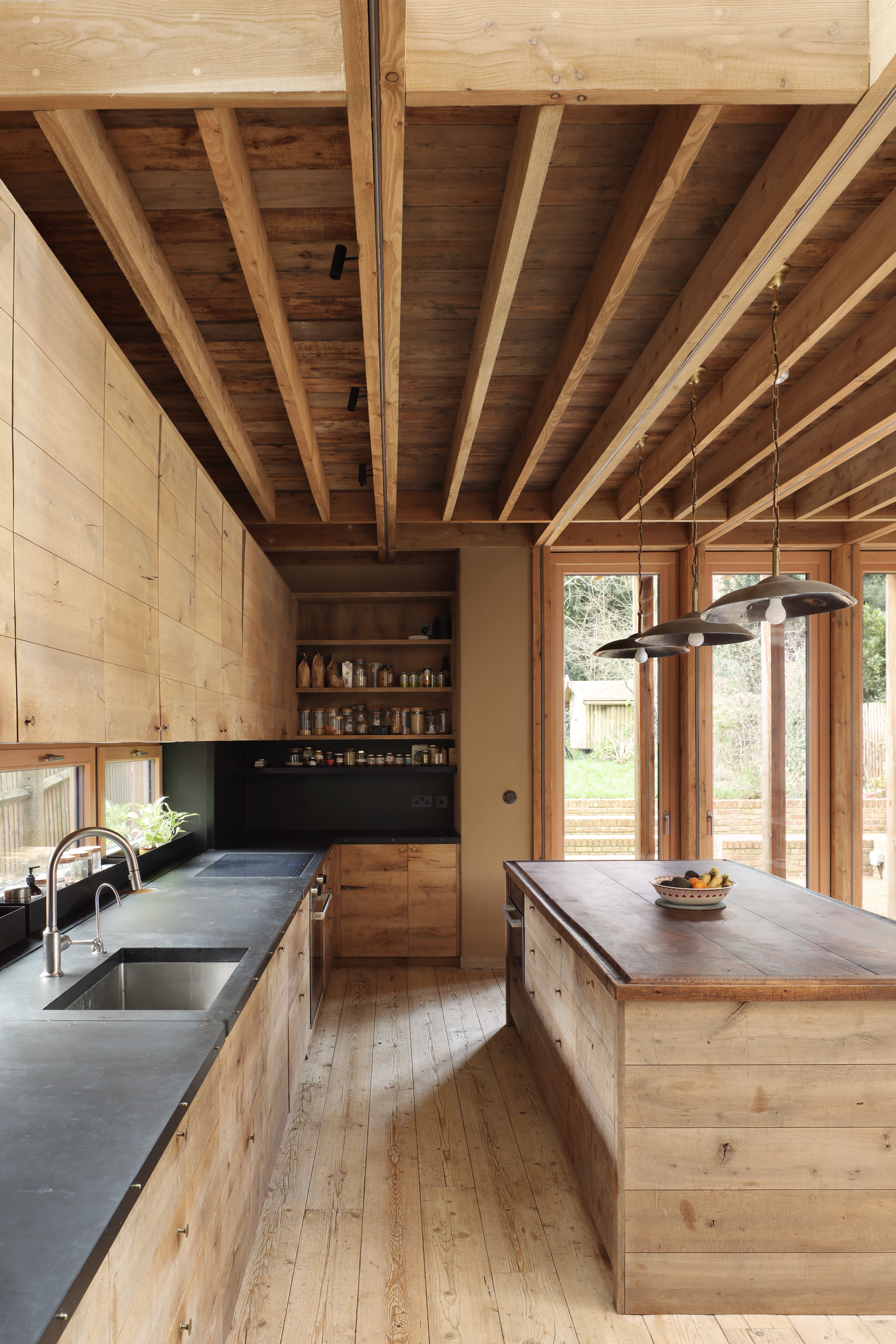 an all timber wabi sabi style kitchen with exposed rafters