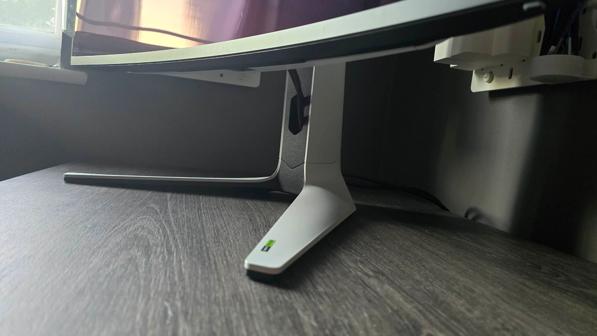 The Alienware AW3225QF QD-OLED monitor stand on a desk