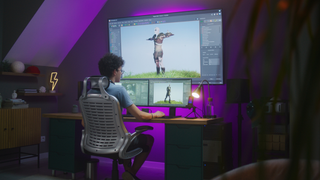 Woman using animation software on a large monitor