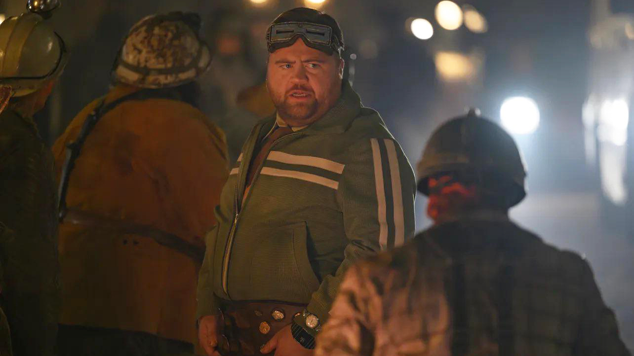 Paul Walter Hauser's Mole Man looking at a soldier in The Fantastic Four: First Steps