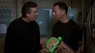 Two characters in Hudson Hawk talking to each other.