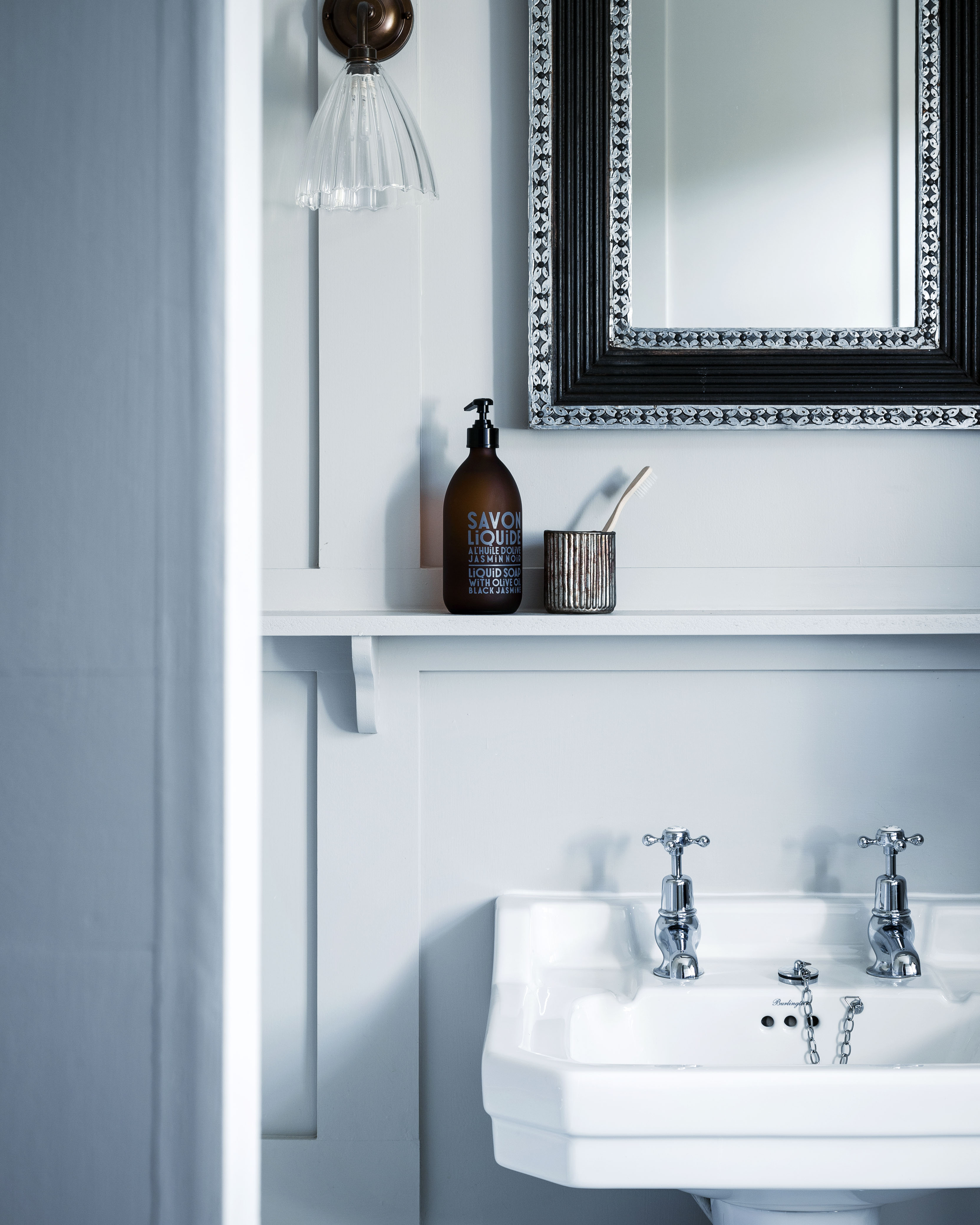 view of a bathroom sink with mirror and cute additions