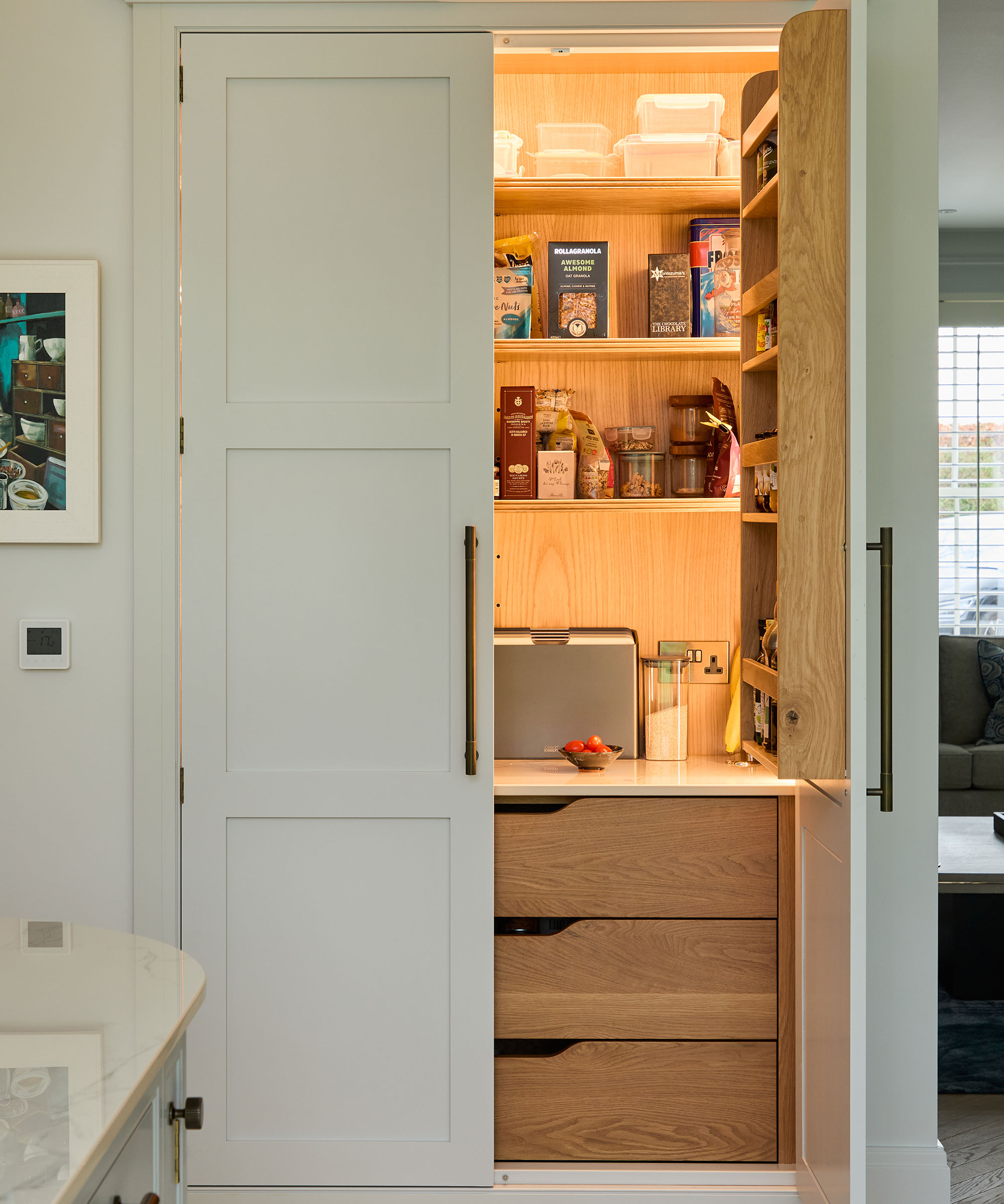 White Shaker pantry unit with wooden drawers