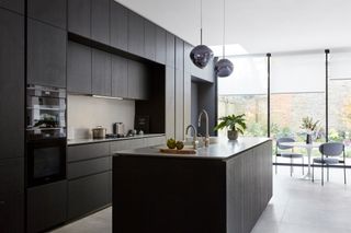 a modern black minimalist kitchen