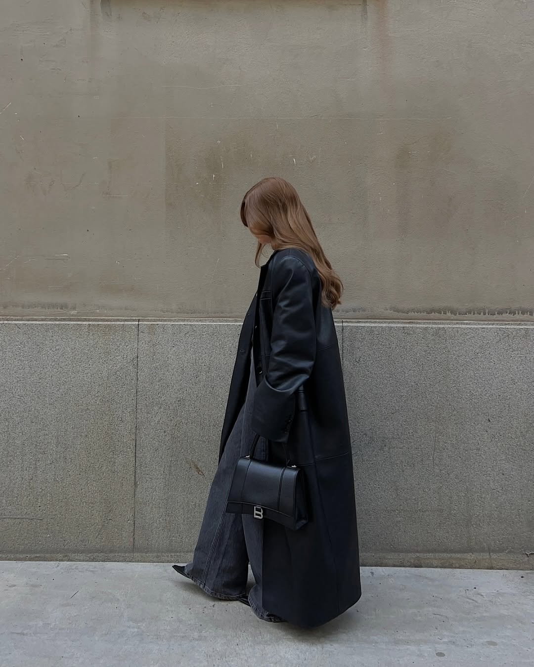 woman wearing leather trench coat jean outfit spring 2026