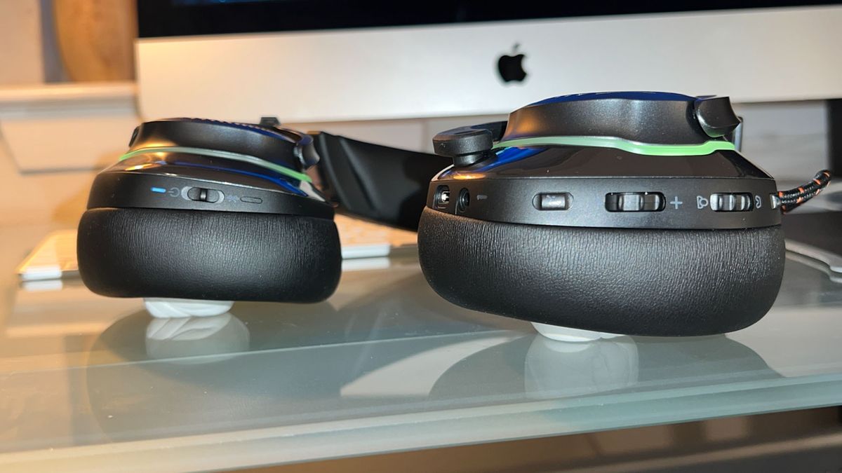 A JBL Quantum 810 Wireless gaming headset on a desk