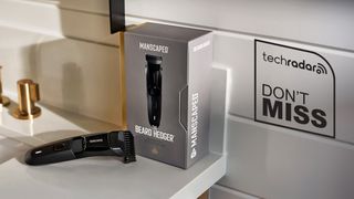 Manscaped Beard Hedger beard trimmer on bathroom a sink, next to its box.