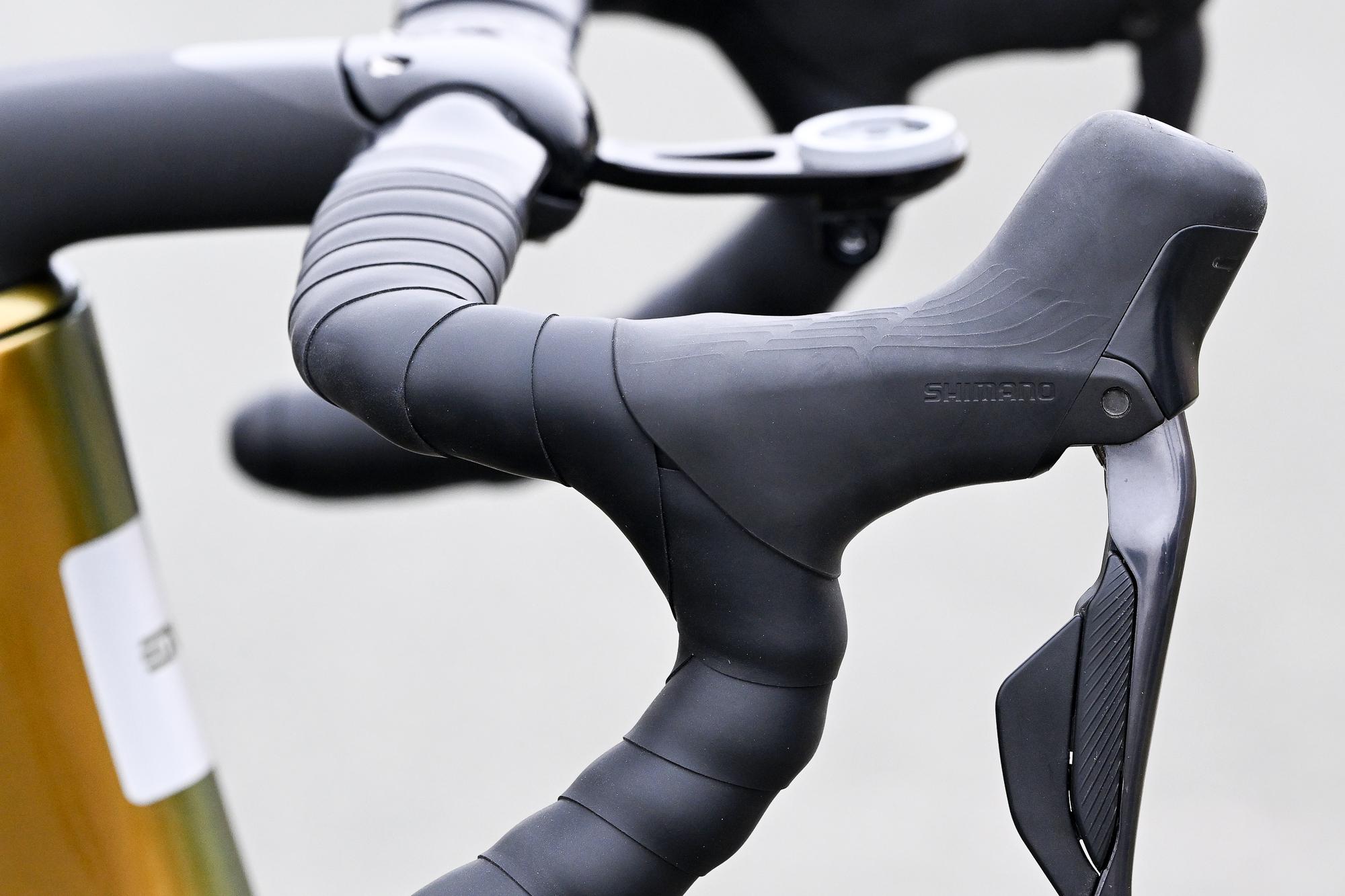 the black wolf tooth supple light bar tape wrapped around an enve bar which is fitted to a lovely yellow MOG.