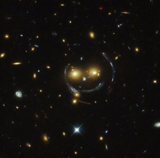 Smiling Face of Galaxy Cluster SDSS J1038+4849