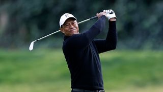Tiger Woods plays an iron shot during the Genesis Invitational second round