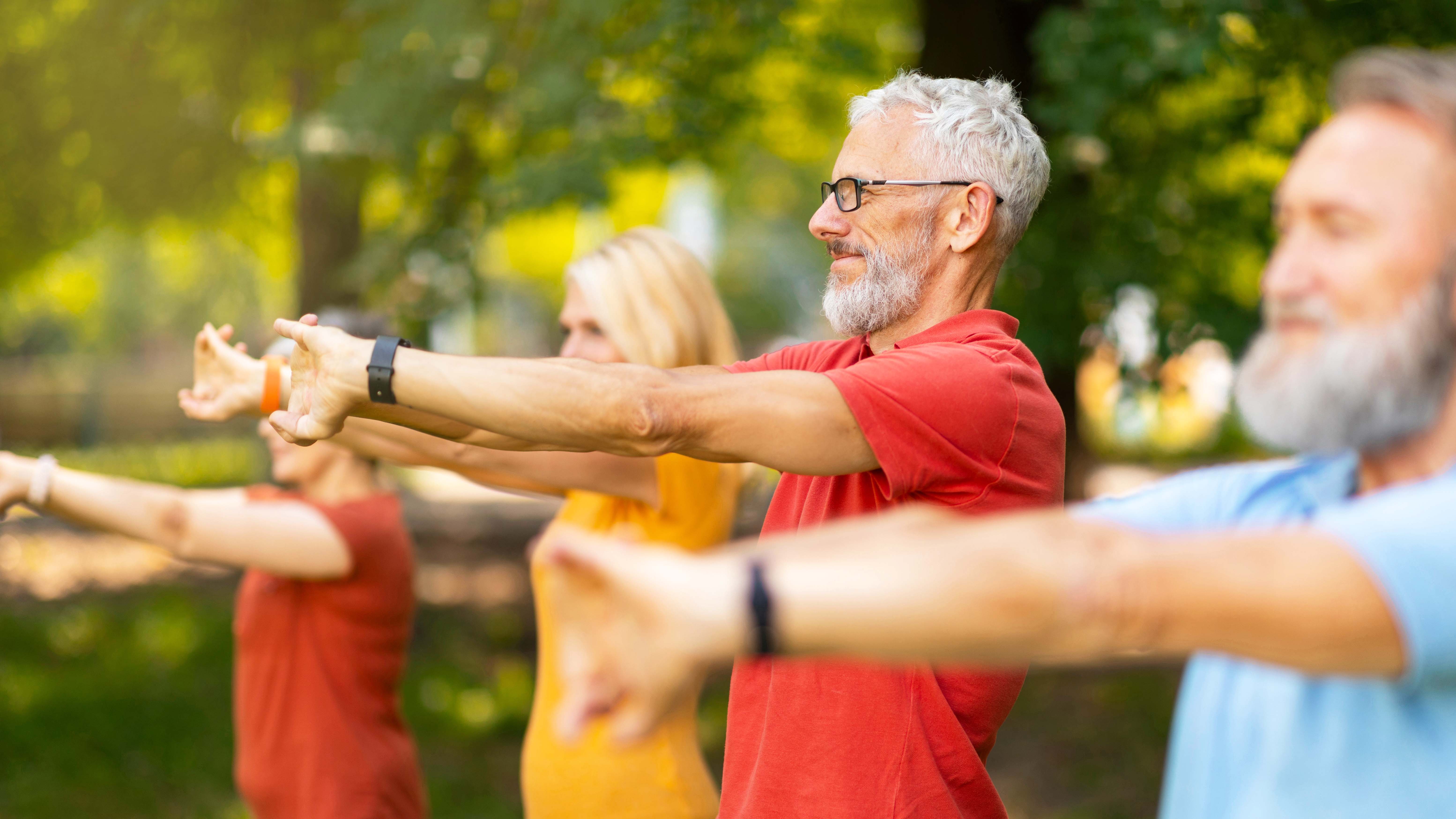 a photo of a senior man stretching