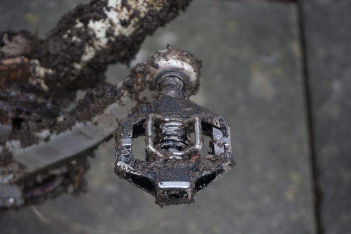 A close up of a black gravel bike pedal