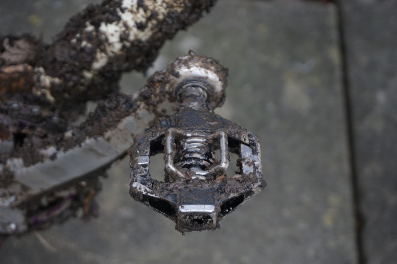 A close up of a black gravel bike pedal