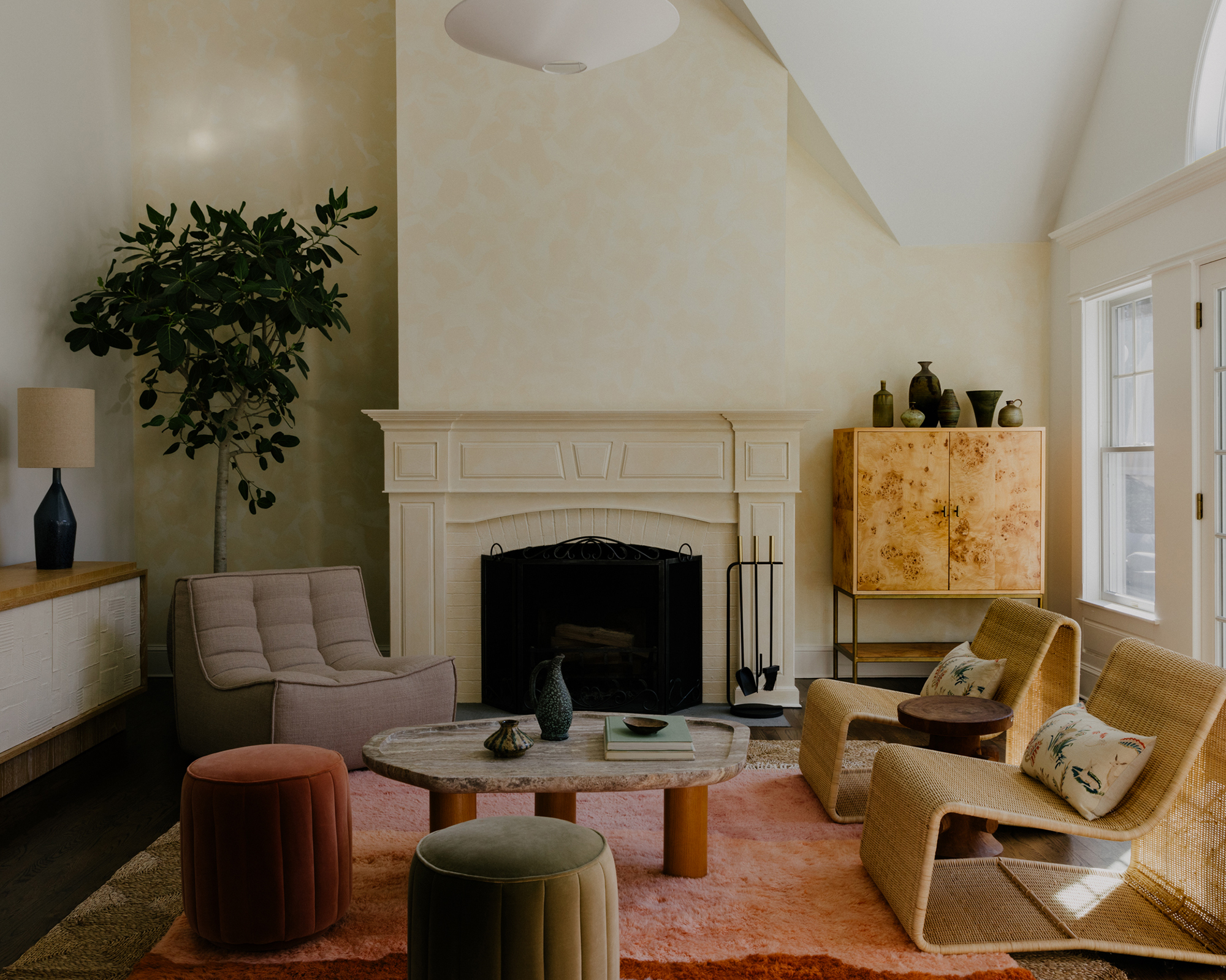 living room with pink rug and modern seating