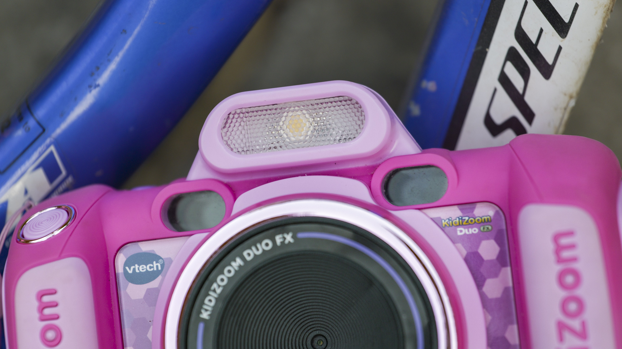 The fill light of a pink V-Tech KidiZoom Duo camera