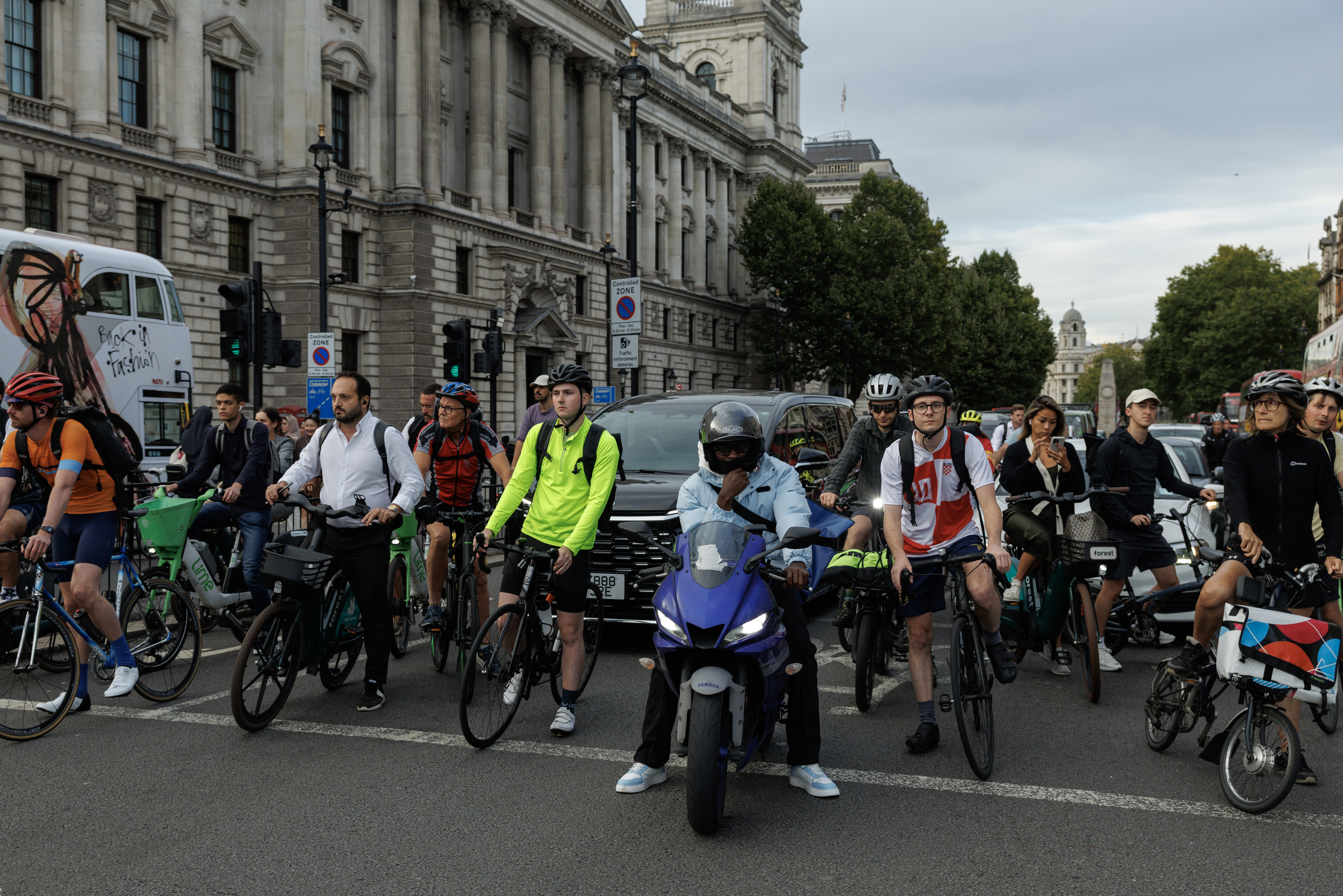 A line of cyclists on their commute in London