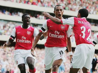 Gilberto (C) of Arsenal celebrates with team mates Theo Walcott (R) and Kolo Toure (L) after scoring the equalising goal during the Barclays Premiership match between Arsenal and Aston Villa at The Emirates Stadium on August 19, 2006 in London, England.