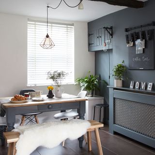 kitchen with grey and white wall and dining table