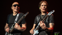 Joe Satriani (left) and Steve Vai perform onstage together in 2024