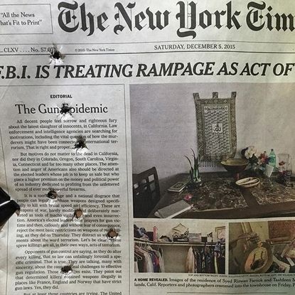 Conservative pundit Erick Erickson's shot bullets through his copy of The New York Times' editorial on gun control