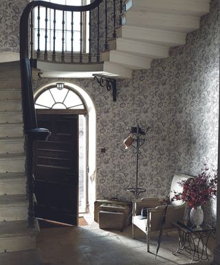 Hallway decorated with toile wallpaper from Little Greene