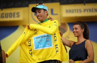 Fabio Aru puts on the yellow jersey after stage 12 at the Tour de France