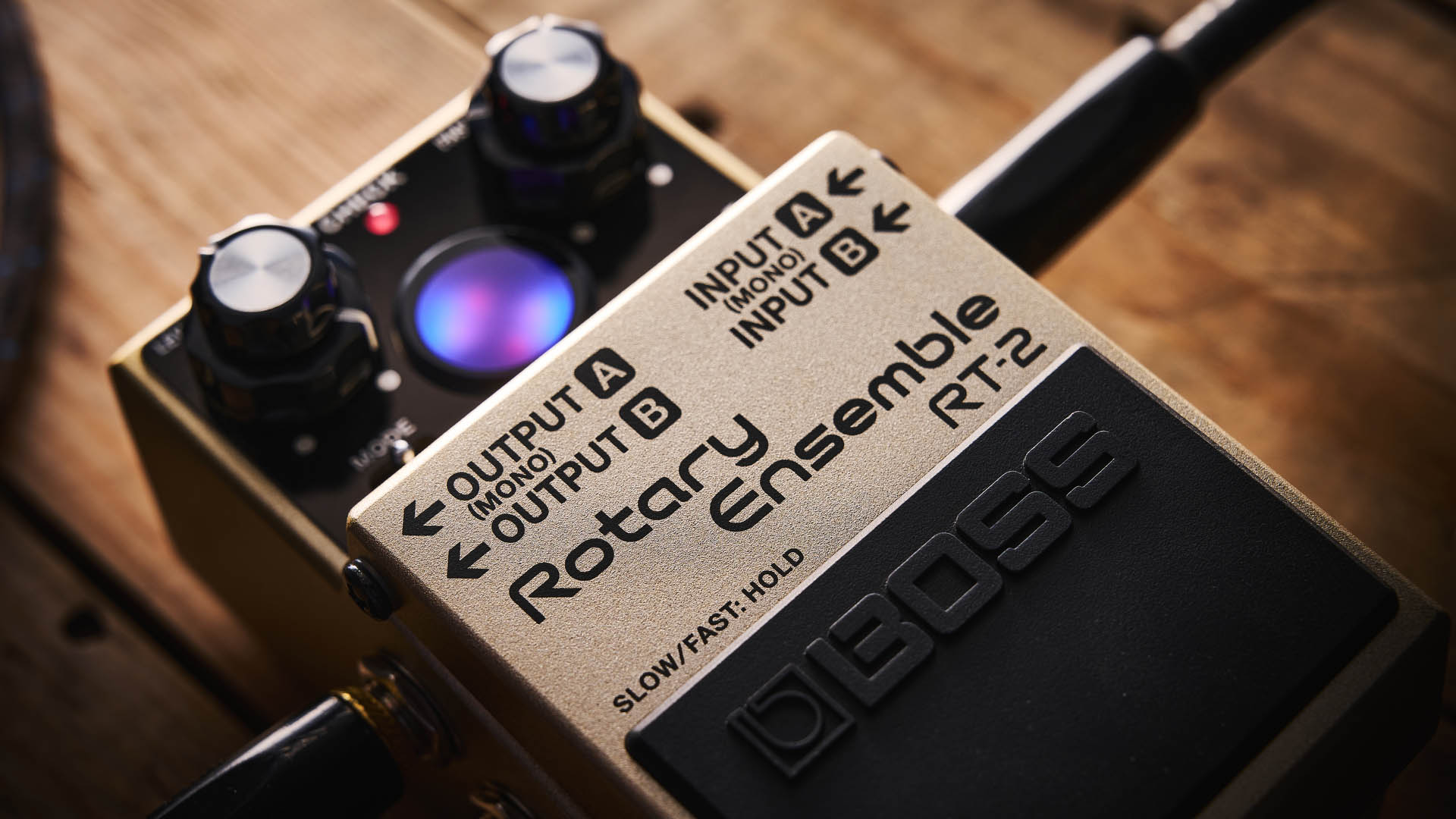 The Boss RT-2 Rotary Ensemble pictured in close-up against a wooden floor.