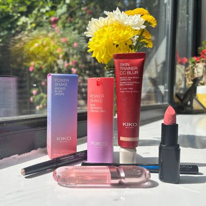 a group of kiko milano products on a sunny window ledge