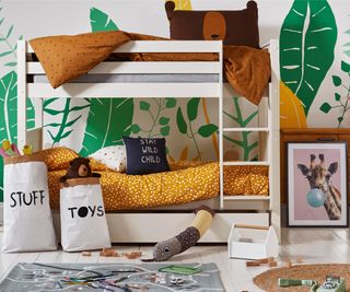 white bunkbeds with yellow bedding and jungle mural with bear on the wall