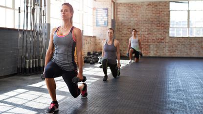 Women complete a dumbbell workout