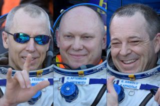 Soyuz MS-08 crewmates Drew Feustel, Oleg Artemyev and Ricky Arnold are seen after landing from the International Space Station on Oct. 4, 2018.