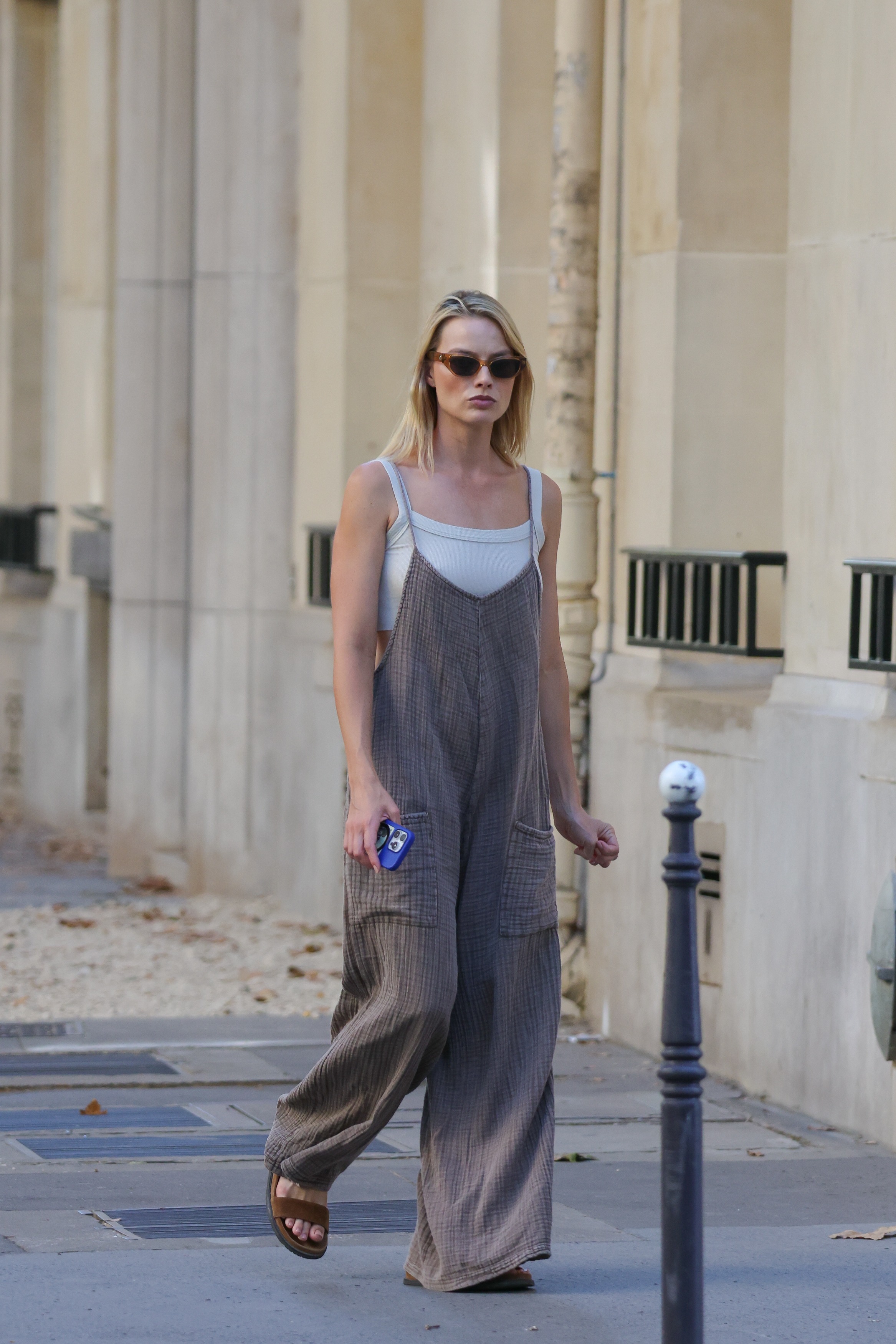 Margot Robbie styled a white tank top as one of summer's biggest shirt trends