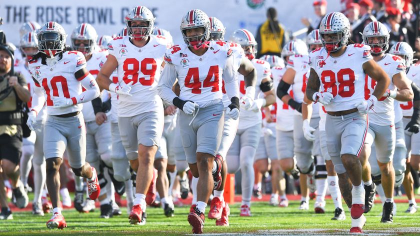 Ohio State players run onto the field the College Football Playoffs quarter-final