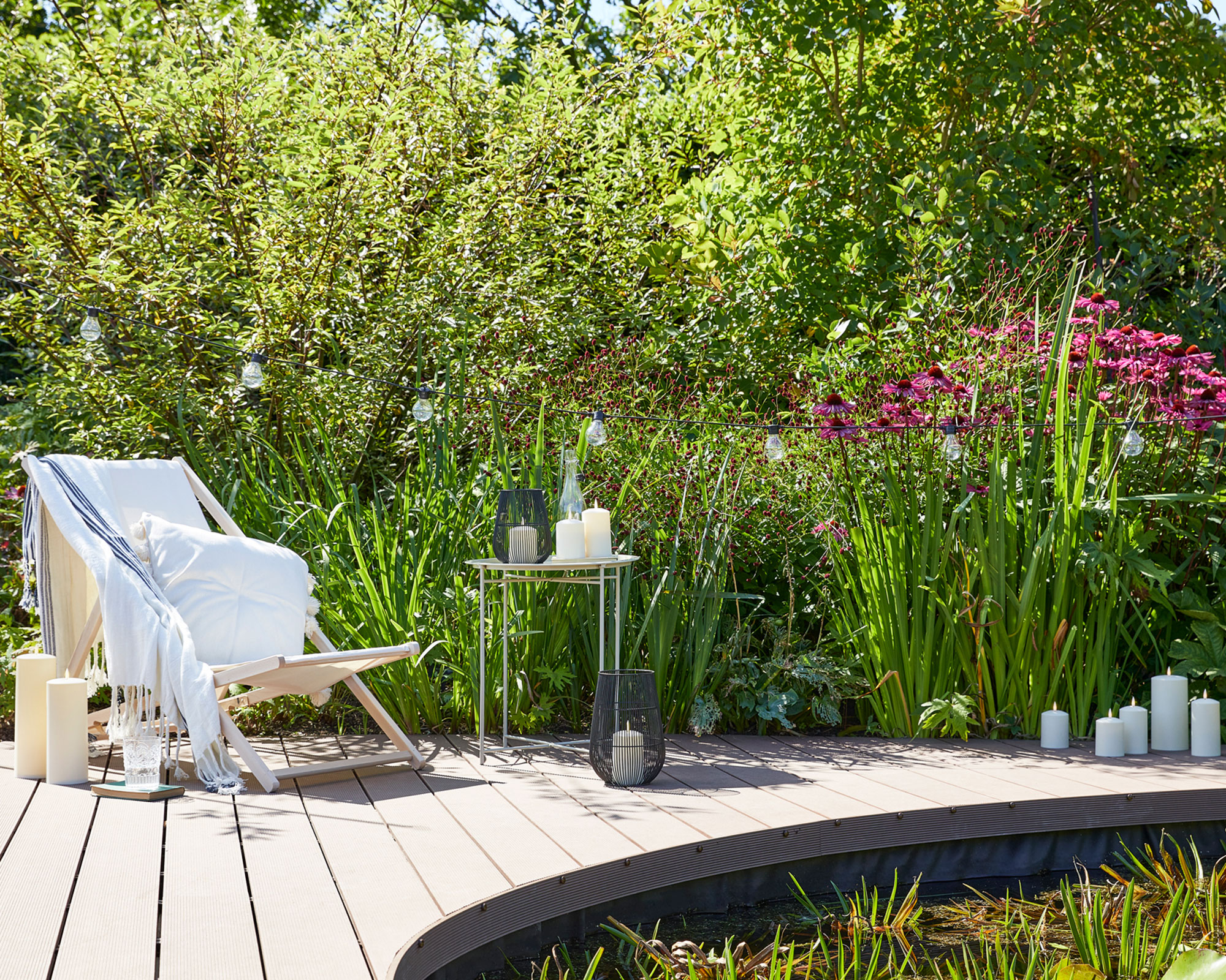 A deck idea with deck chair, slimline table and faux candles by Lights4Fun