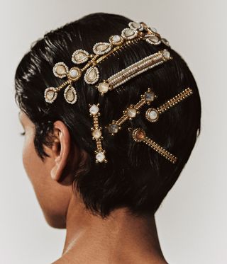 back of model's head, with Goossens bridal jewellery in hair